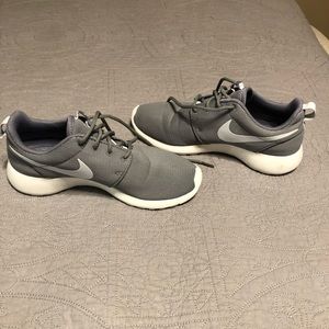 Gray Nike tennis shoes